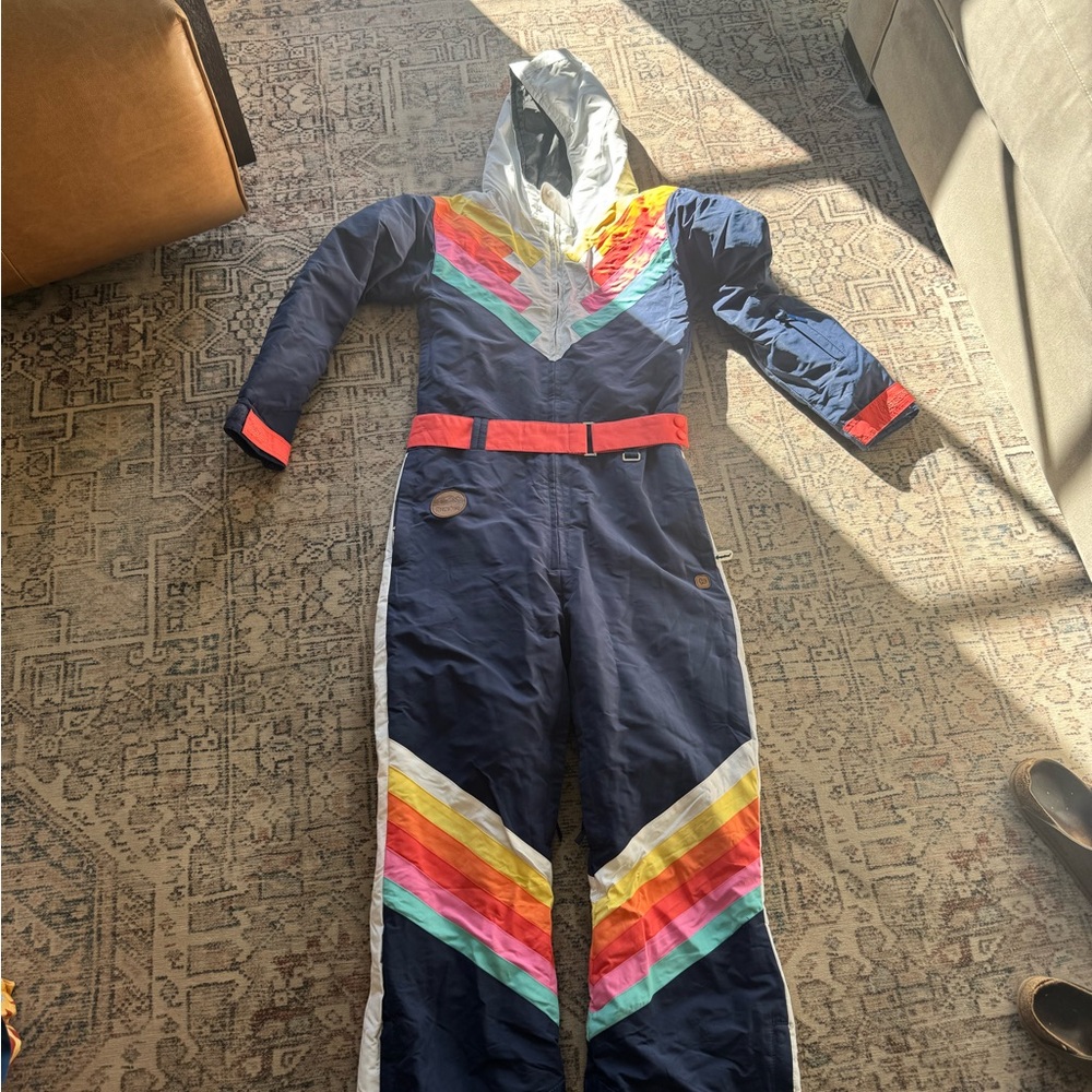 Tipsy Elves Navy One-Piece Ski Suit with Rainbow Chevron Accents